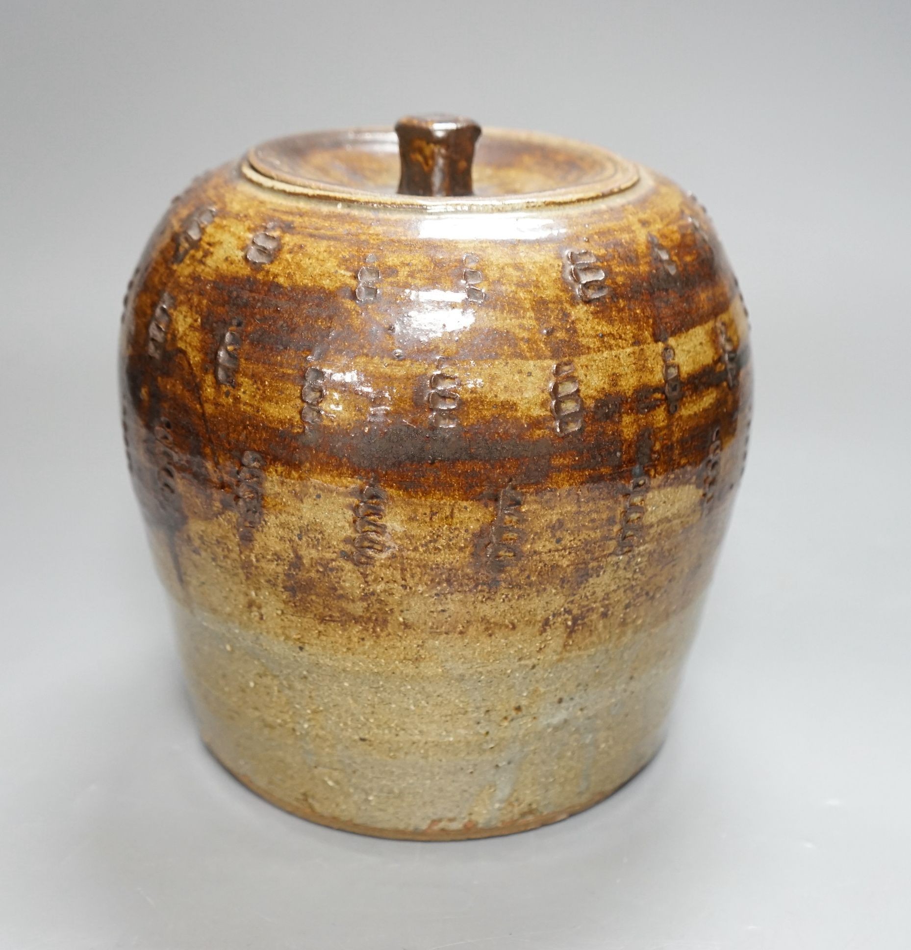 William Marshall (1923–2007), a brown glazed stoneware jar and cover, impressed mark, 22cm tall